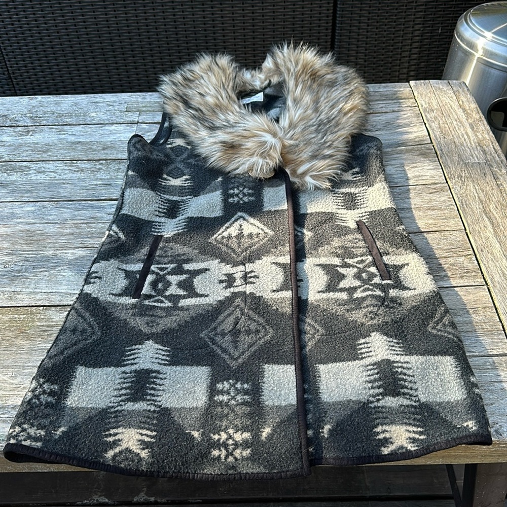 Native American style long vest with fur collar and button closure